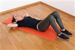 Girl on mat ready to do a sit up 
